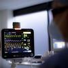 A Sedation Center doctor prepares for a procedure.
